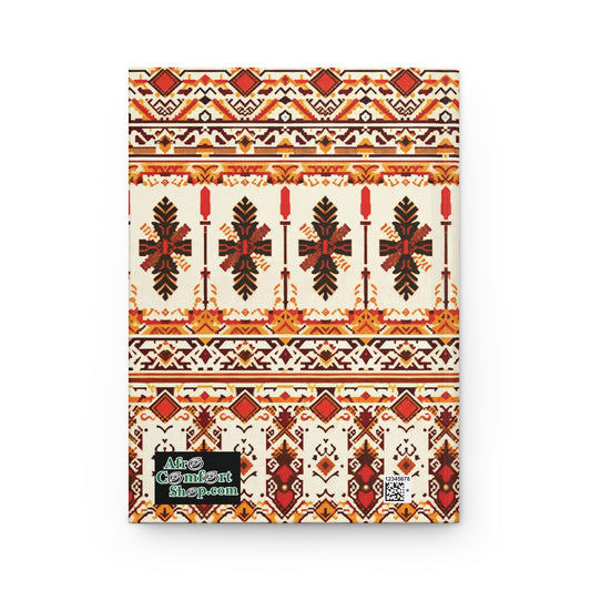 A rectangular African-inspired hardcover journal featuring a folk geometric pattern in red, brown, orange, and yellow on cream. The lower left corner displays a green and black “Afro Comic Art Shop.com” label and a small QR code.