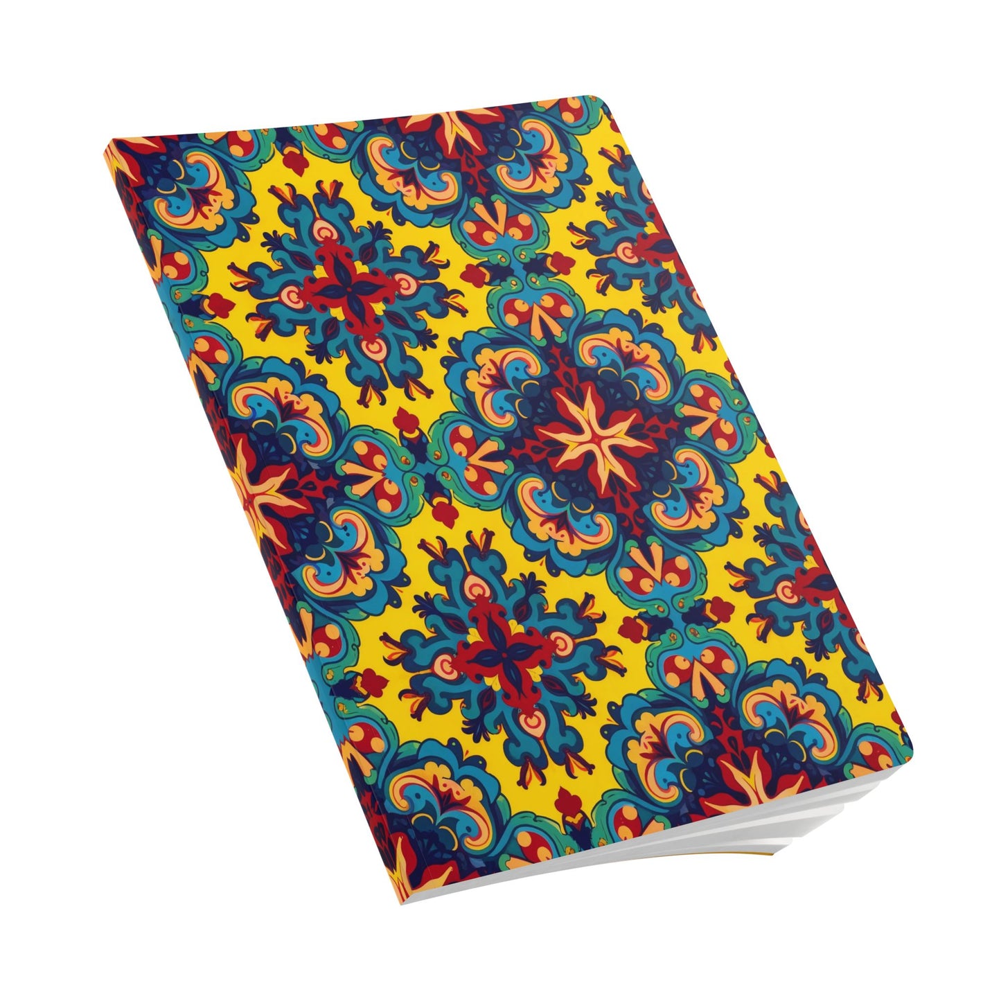 A closed African-inspired journal with a vibrant, intricate pattern of blue, red, and orange symmetrical floral designs on a bright yellow background. Perfect for creative journaling, its angled position reveals a few crisp white pages at the corner.