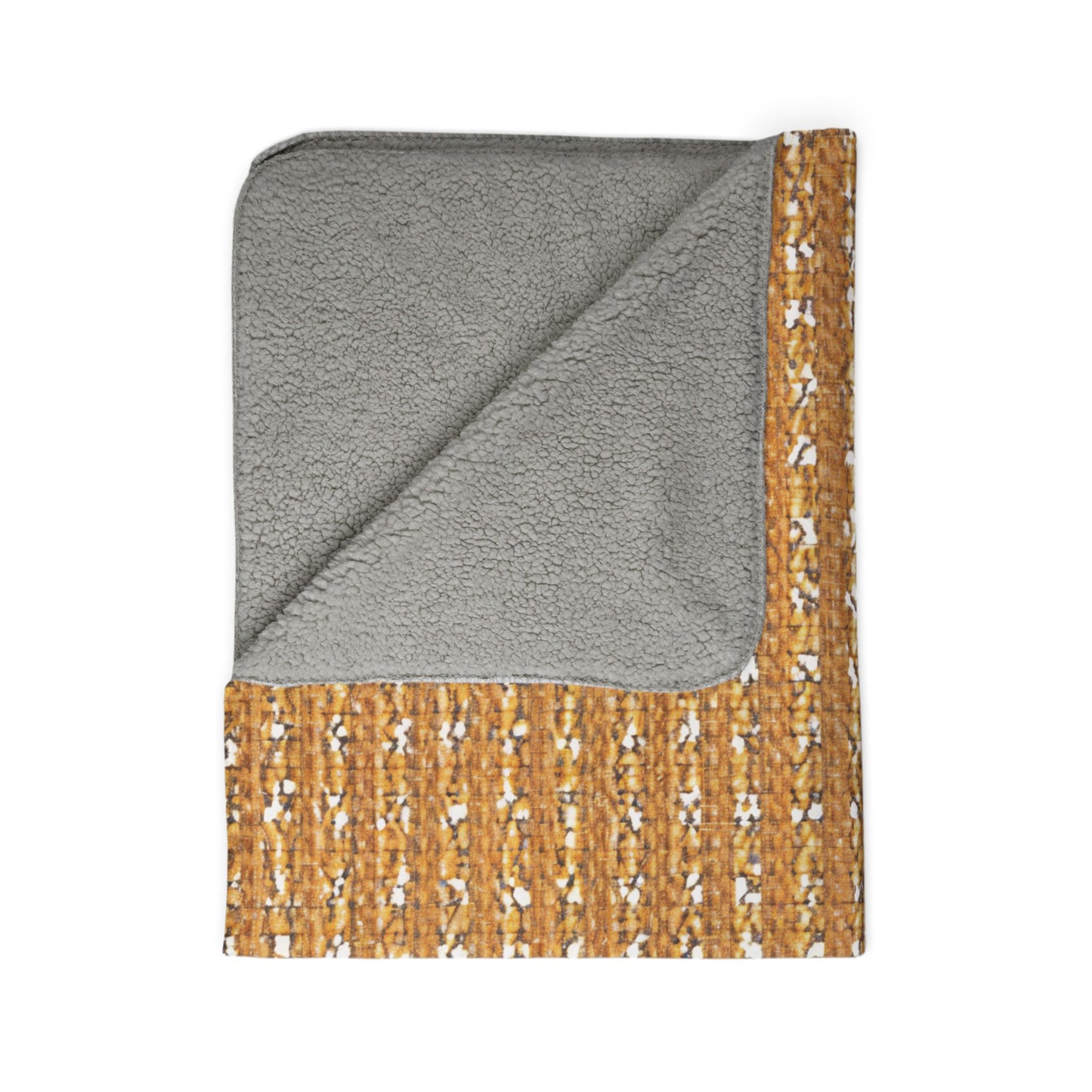 A folded blanket with a soft, light gray sherpa fleece lining and an outer side featuring a mustard yellow, woven-like pattern with small white and brown accents—perfect for cozy home decor, displayed on a white background.