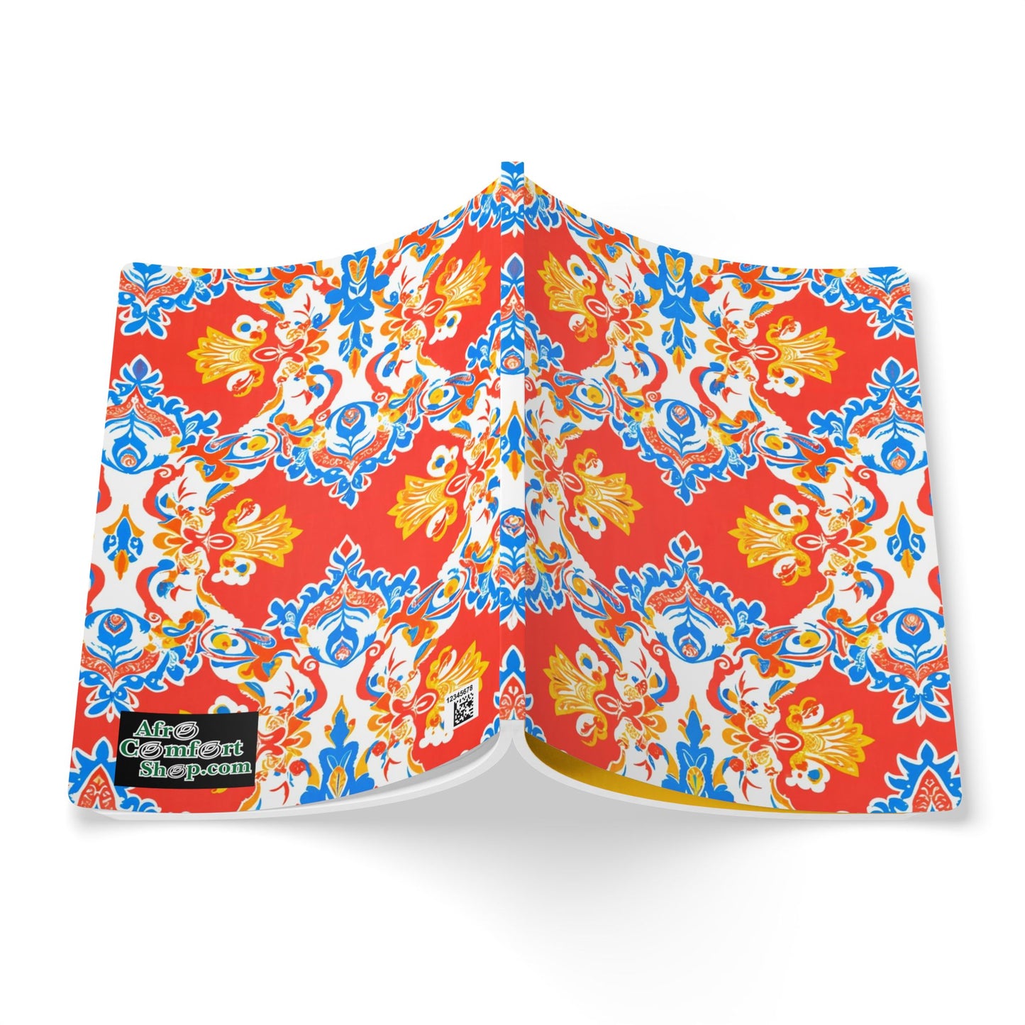 An open book displays a vibrant, symmetrical pattern with red, blue, and yellow floral and ornamental shapes on a white background—perfect for creative journaling or as an African-inspired journal. A small black and green logo in the bottom left reads the contentshop.com.