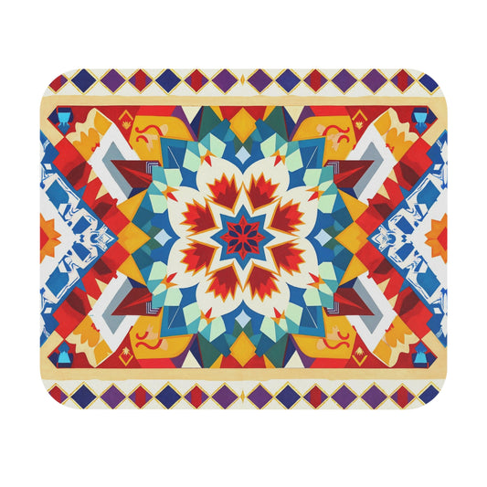 Colorful geometric mandala with a central starburst in red, blue, orange, and white; surrounded by abstract forms and bordered by purple, yellow, and red diamonds. This African-inspired mouse pad features a non-slip rubber base for lasting durability.