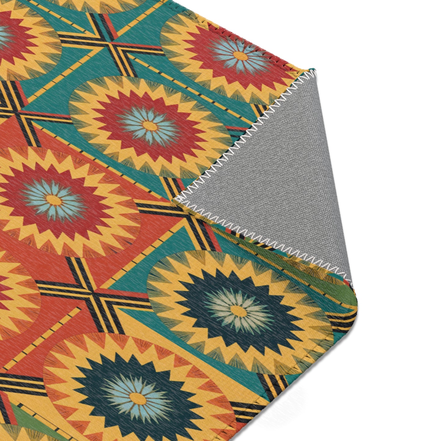 A close-up of a textile with a geometric, Southwestern-inspired pattern. Crafted from durable polyester chenille, the design features repeating circular sunburst shapes in red, yellow, teal, and blue inside squares. One corner reveals a plain gray underside with white stitching.