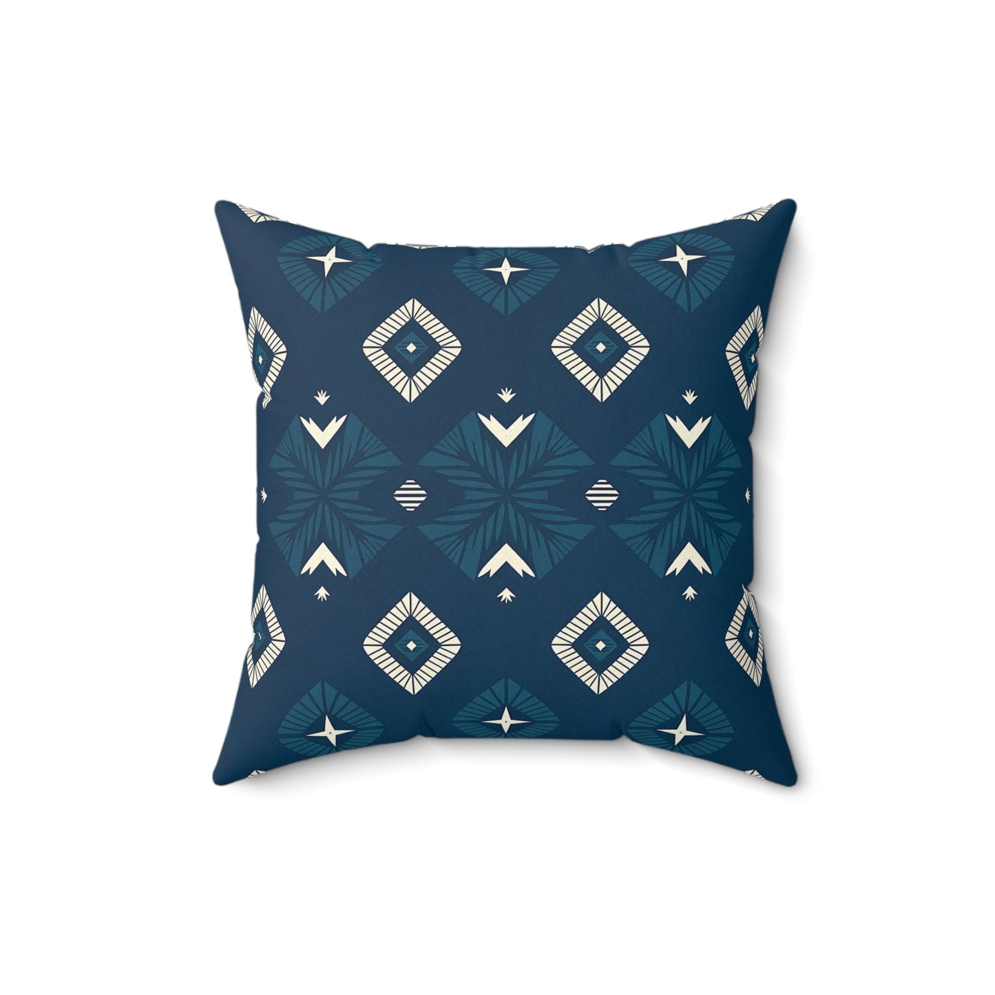 Square pillow with a dark blue background featuring a geometric pattern of diamond and star shapes in white and teal. This vibrant pillow design adds unique home decor appeal with its symmetrical, modern style, photographed on a plain white background.
