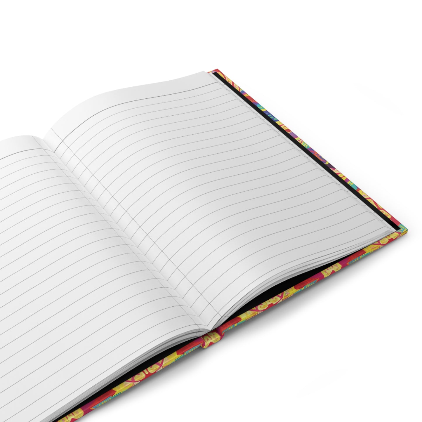 An open hardcover journal with wide-ruled, lined white pages. The colorful cover showcases a playful, African-inspired pattern along the edge. Resting on a white surface, the journal is viewed from a high angle.