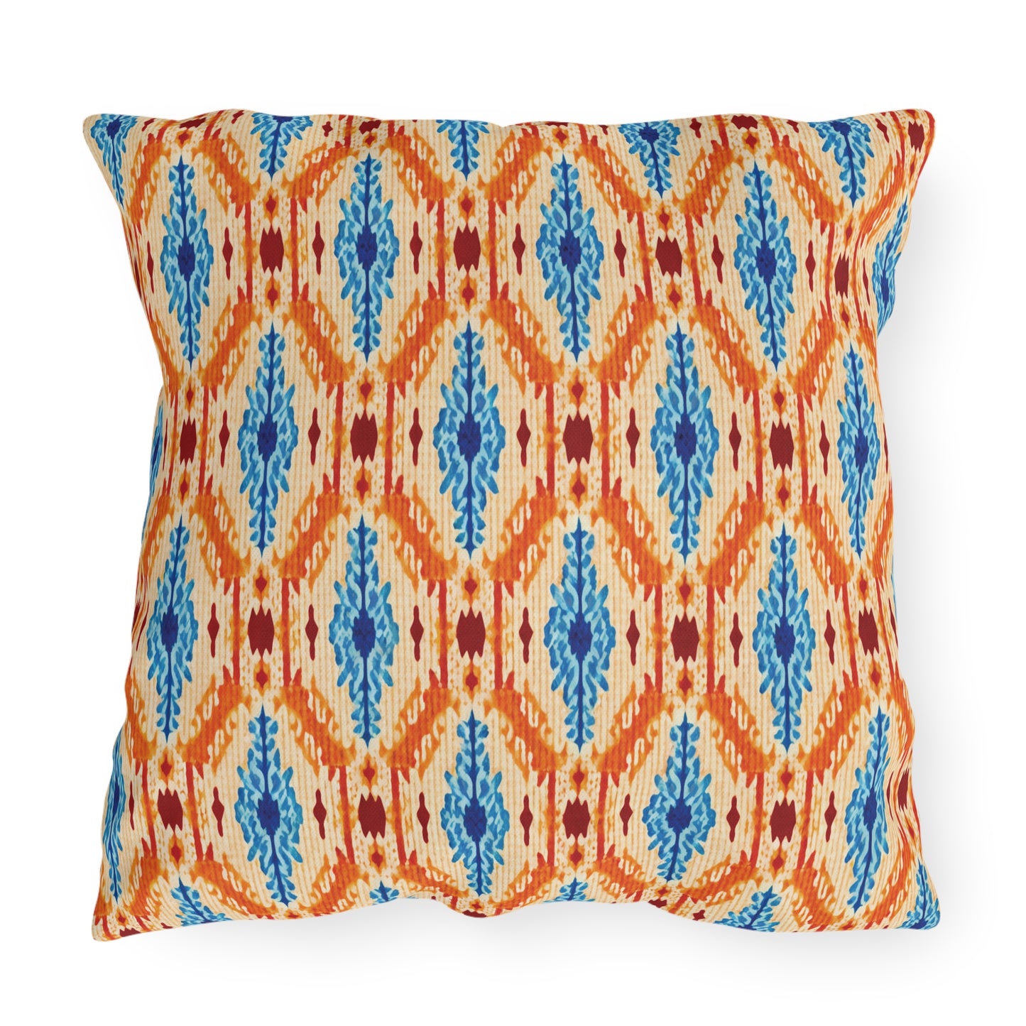 Square outdoor pillow with a textured fabric featuring a geometric zigzag pattern in orange, with blue and maroon decorative elements on a cream background. Water-resistant for durability, the design has a bold and colorful appearance.