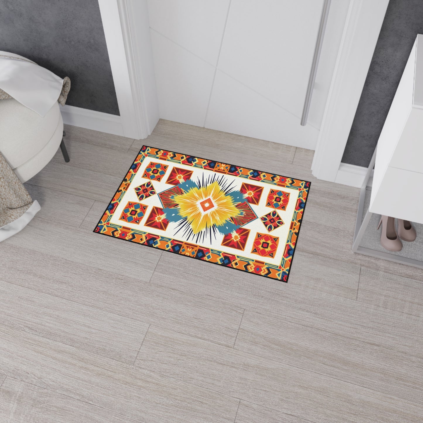 A colorful rectangular rug with African-inspired geometric, star, and diamond patterns in red, orange, yellow, blue, and white sits on a light gray tile floor near a door. It features a non-slip rubber backing for added safety.