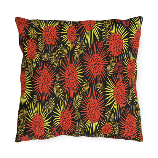 A square pillow with a bold, African-inspired floral pattern featuring large, stylized red and yellow flowers with radiating petals and spiky leaves on a black background. The vibrant design creates a lively, eye-catching effect.