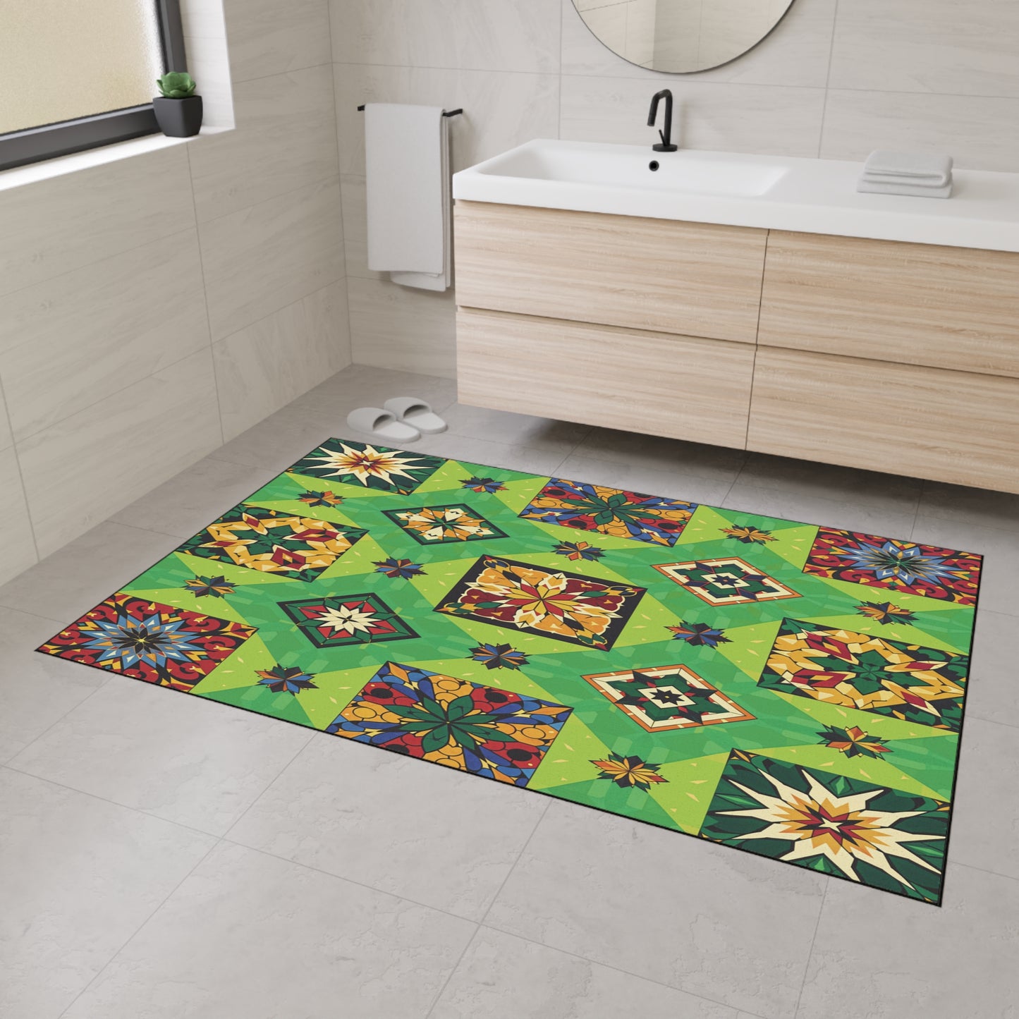 A bright bathroom with a wood vanity and white sink features a large, rectangular rug with a colorful geometric and floral patchwork pattern, inspired by African-inspired home decor, plus non-slip rubber backing for safety on the light tiled floor.