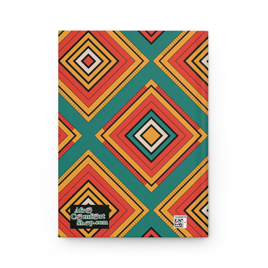Rectangular geometric hardcover notebook with a bold pattern of nested diamonds in red, orange, yellow, and teal. The bottom left features the AfroComiArt shop.com logo; a QR code is visible in the bottom right corner. Inspired by African textile journal design.