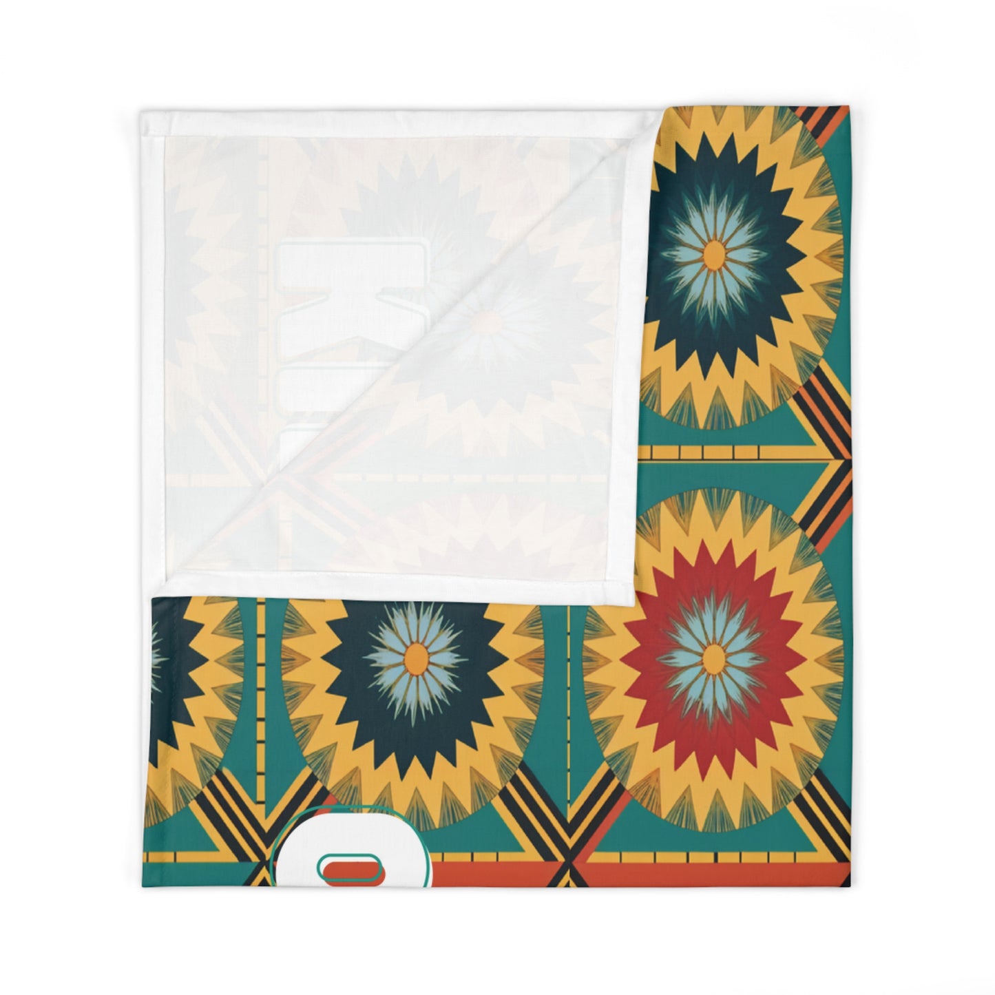 A folded baby swaddle blanket featuring a geometric, radial starburst pattern in shades of yellow, green, navy, red, and orange. The corner is turned up, revealing the plain white underside—perfect for African-inspired decor. Partial shapes and lettering line the edge.