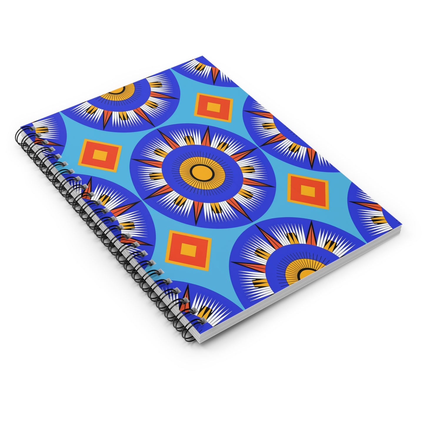 A spiral-bound notebook with a vibrant, geometric cover design featuring blue, orange, yellow, and black starburst and diamond shapes on a blue background. This African-inspired spiral notebook offers a premium writing experience with culturally inspired designs.