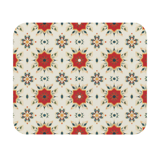 A repeating geometric pattern features red, orange, and green star-shaped motifs on a cream background. This African-inspired mouse pad is a creative desk accessory with layered points and a non-slip rubber base for added stability.