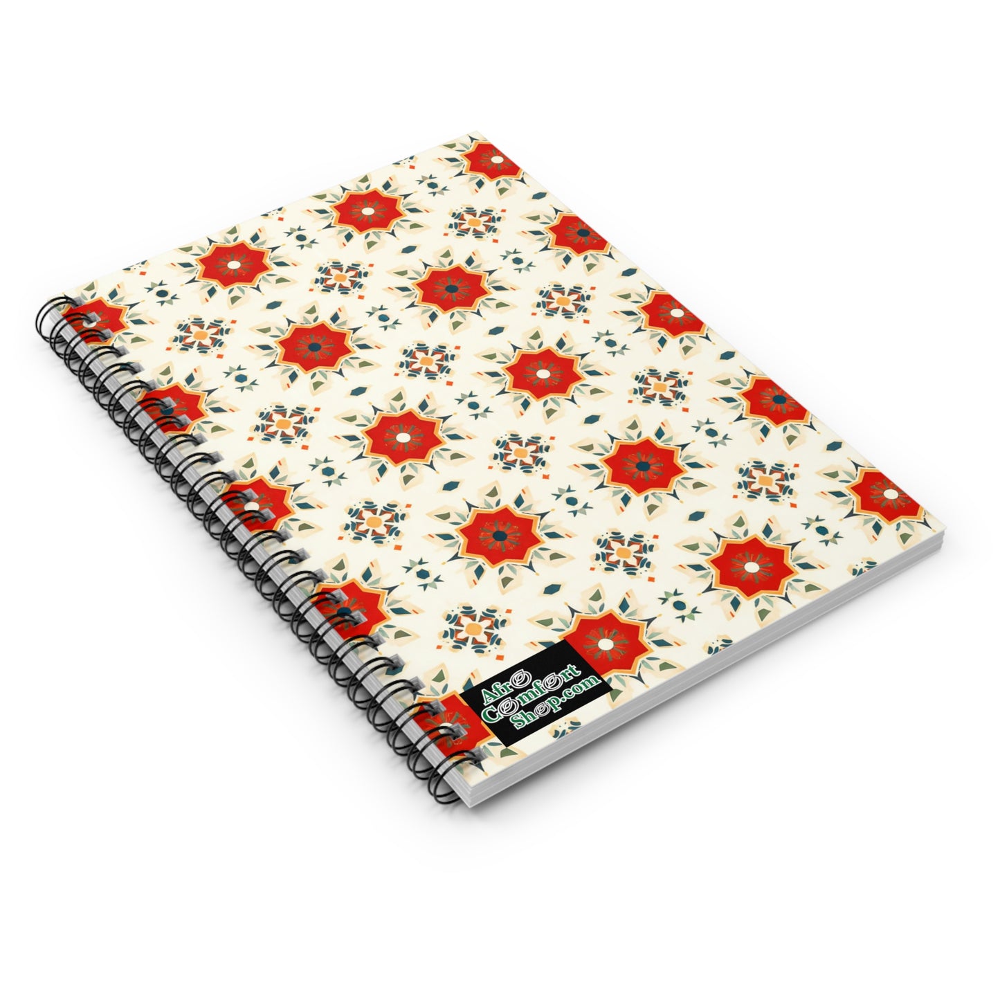 A premium writing notebook with a cream cover featuring red and orange star-shaped flowers and blue accents. This African-inspired spiral notebook includes a black label in the corner reading “Abstract Impression.”.