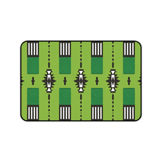 A rectangular Neoprene desk mat featuring a stylized green pattern resembling a football field, with white yard lines, black markings, arrows, chevrons, and geometric accents. Rounded edges and a black border make it an ergonomic desk mat for any workspace.