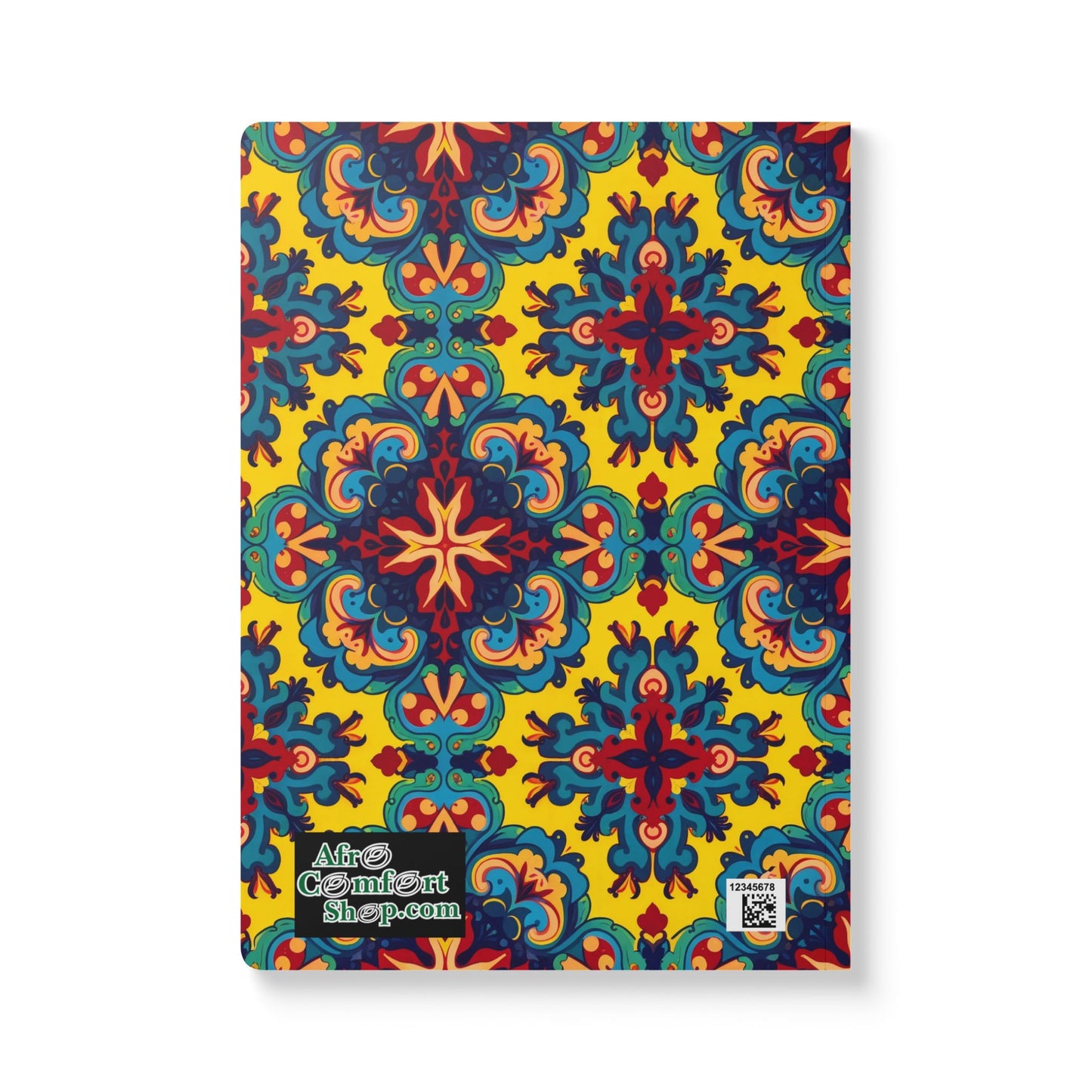 A creative journal with a vibrant, symmetrical floral and geometric pattern in blue, red, and yellow on a yellow background. The bottom left corner features the AfroComfortShop.com logo and a small QR code. Perfect for daily journaling.
