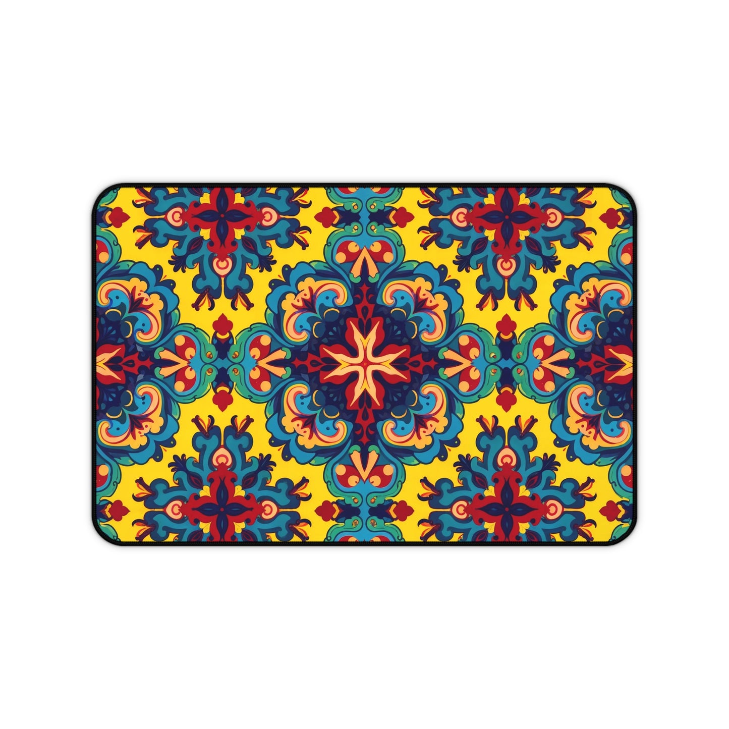 A rectangular Neoprene desk mat with an intricate, symmetrical floral pattern in red, blue, teal, and orange on a bright yellow background. This ergonomic desk mat adds a kaleidoscopic flair as a colorful workspace accessory within a thin black border.
