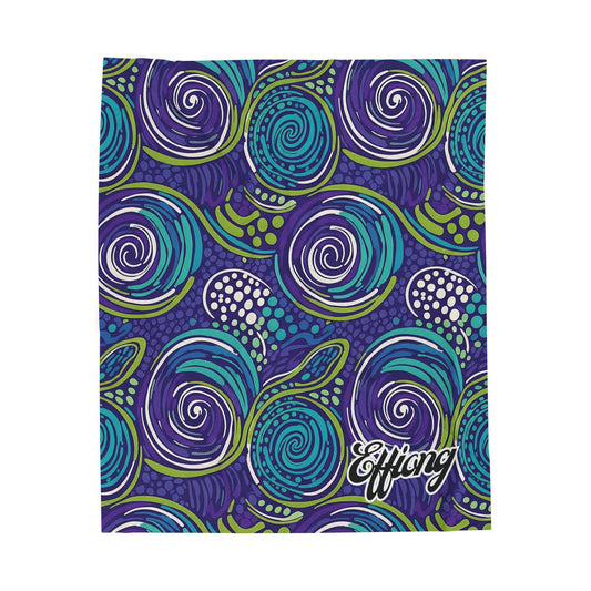 A bold, abstract pattern of swirling spirals in purple, blue, teal, and green, accented with white dots, makes this African-inspired blanket stand out. The word Efflong appears in white script on a deep purple background.