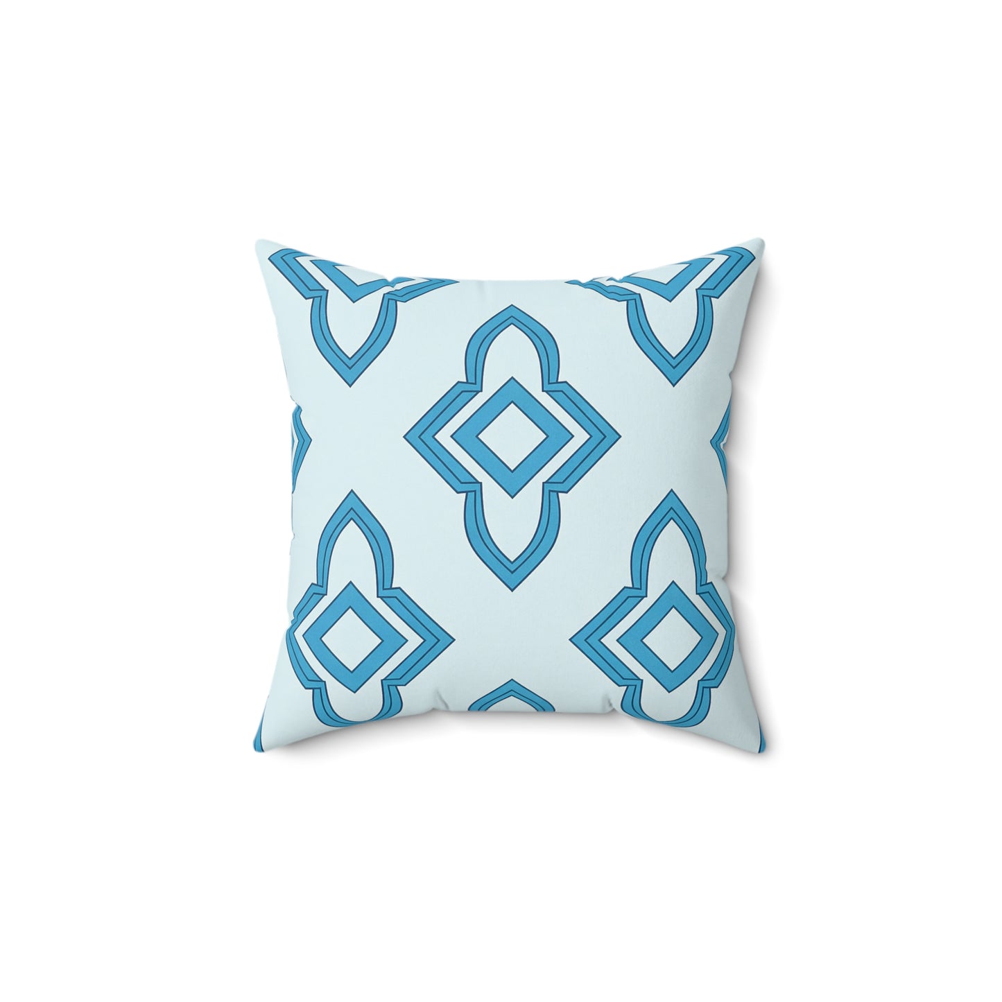 A square faux suede pillow with a light blue background features a geometric diamond pattern in darker and lighter shades of blue, arranged symmetrically. The pillow is shown against a plain white backdrop, offering an elegant African accent pillow style.