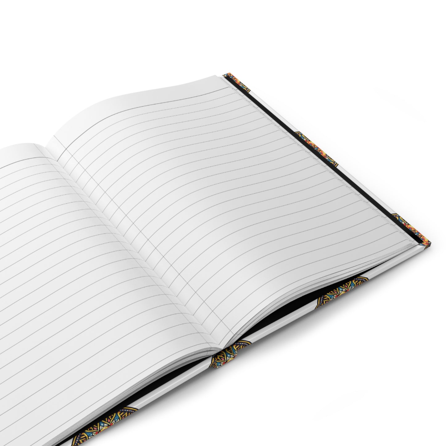 An African-inspired hardcover journal with lined pages lies on a white surface. Its cover edges display a colorful, geometric pattern with hints of yellow, blue, and red. The blank pages invite writing or drawing in this well-lit, minimalistic scene.