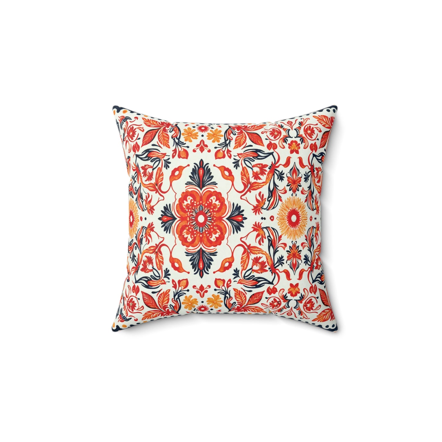 Square decorative pillow featuring a vibrant, symmetrical floral pattern in red, orange, yellow, and navy blue on white. This faux suede pillow includes large central flowers and leafy vines, bringing an ornate touch as a unique African accent pillow.