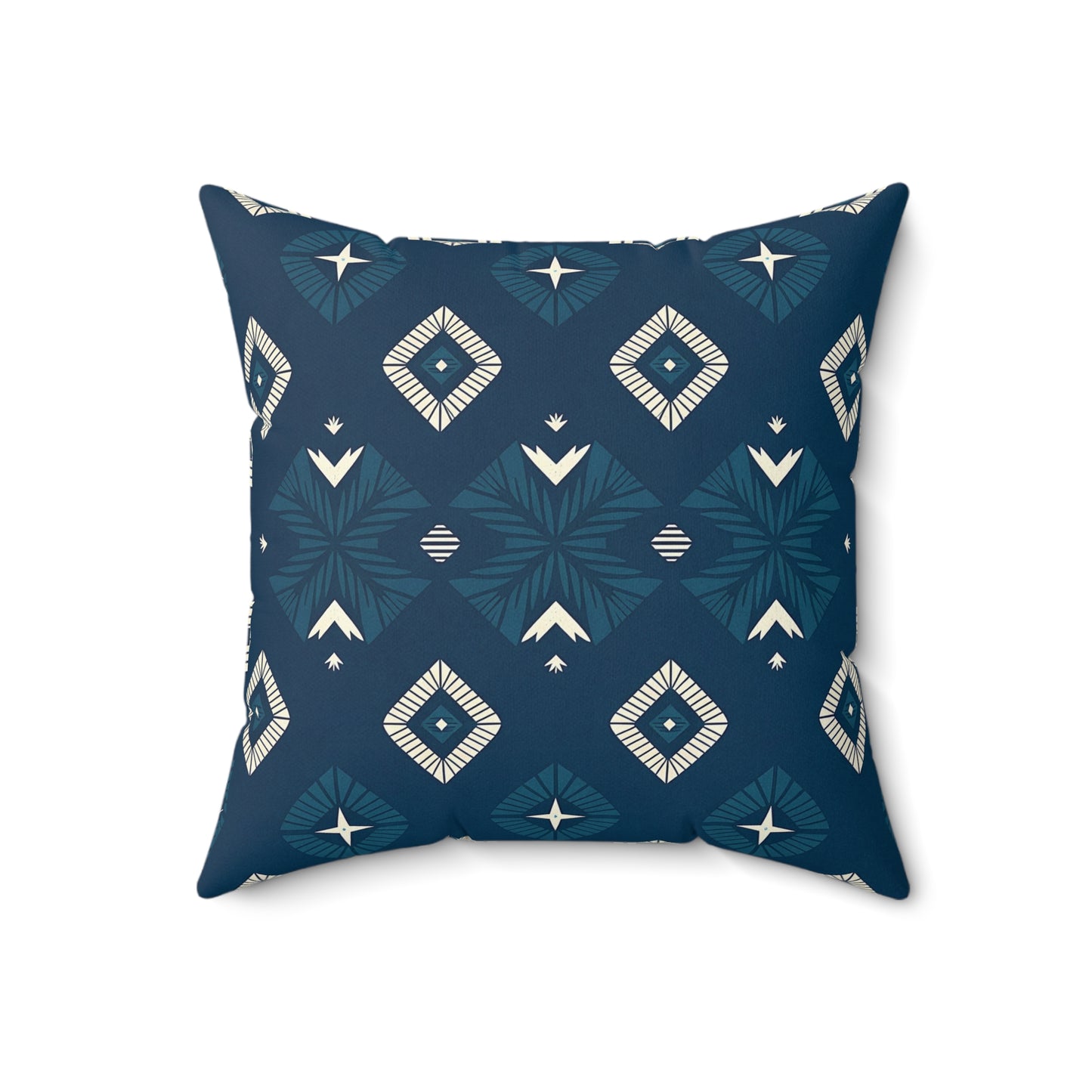 A square pillow with a dark blue background features vibrant pillow designs in cream and teal. Diamond shapes, stylized arrows, and leaf motifs create a modern tribal look—perfect for adding unique home decor to any space.