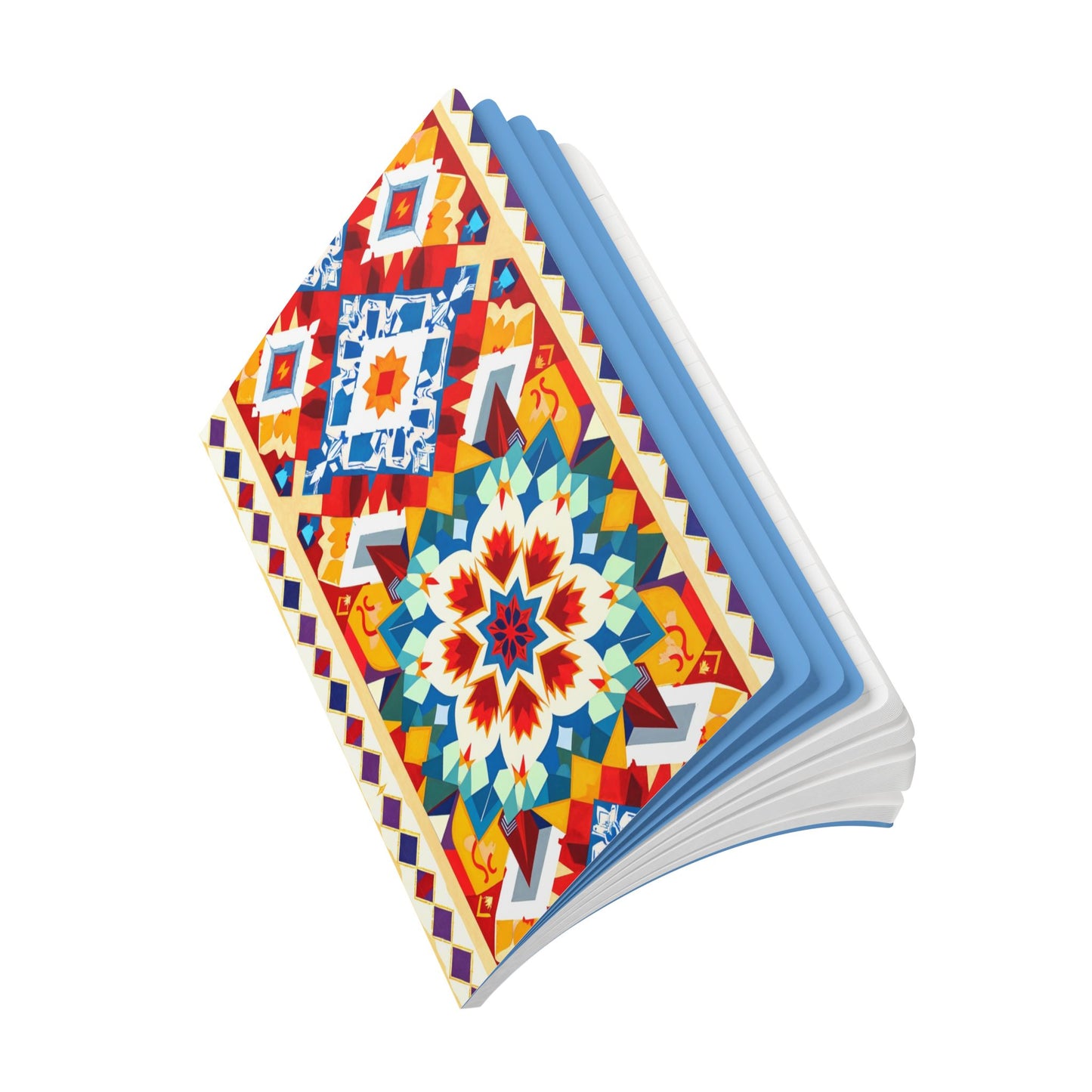 An open African-inspired journal with a vibrant, geometric, multicolored cover featuring symmetrical patterns in red, yellow, blue, and white. The slightly fanned pages have blue-tinted edges and are displayed on a white background.