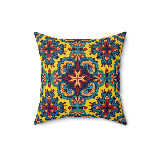 Square pillow with a vibrant pattern featuring symmetrical floral shapes in red, blue, and teal on a bright yellow background. This faux suede square pillow adds a bold, ornamental, Mediterranean-inspired style with an African accent pillow charm.
