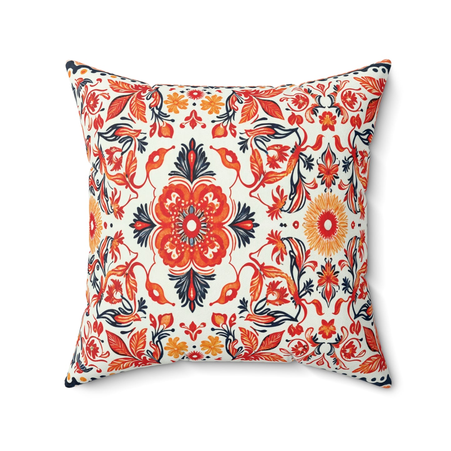 Square throw pillow with an intricate floral pattern in red, orange, yellow, and navy blue on white. This faux suede pillow features a large central flower surrounded by symmetrical vines and blooms, creating a vibrant, decorative look.