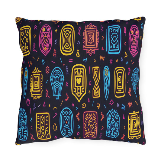 A rectangular pillow with a black background featuring a colorful, African-inspired pattern of abstract, tribal geometric shapes in yellow, blue, pink, and red, arranged in neat rows with small squiggles and accents interspersed.