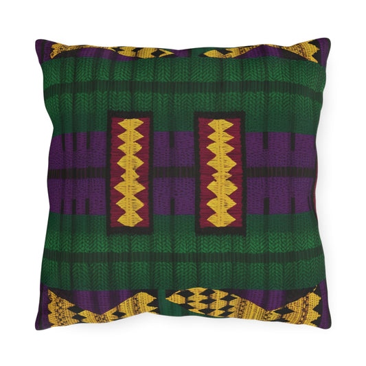 Square outdoor pillow with a colorful Kente-inspired pattern. Made from UV-resistant fabric, it features horizontal green and purple bands, maroon stripes with yellow zigzags, and geometric shapes in gold, purple, and green on white.