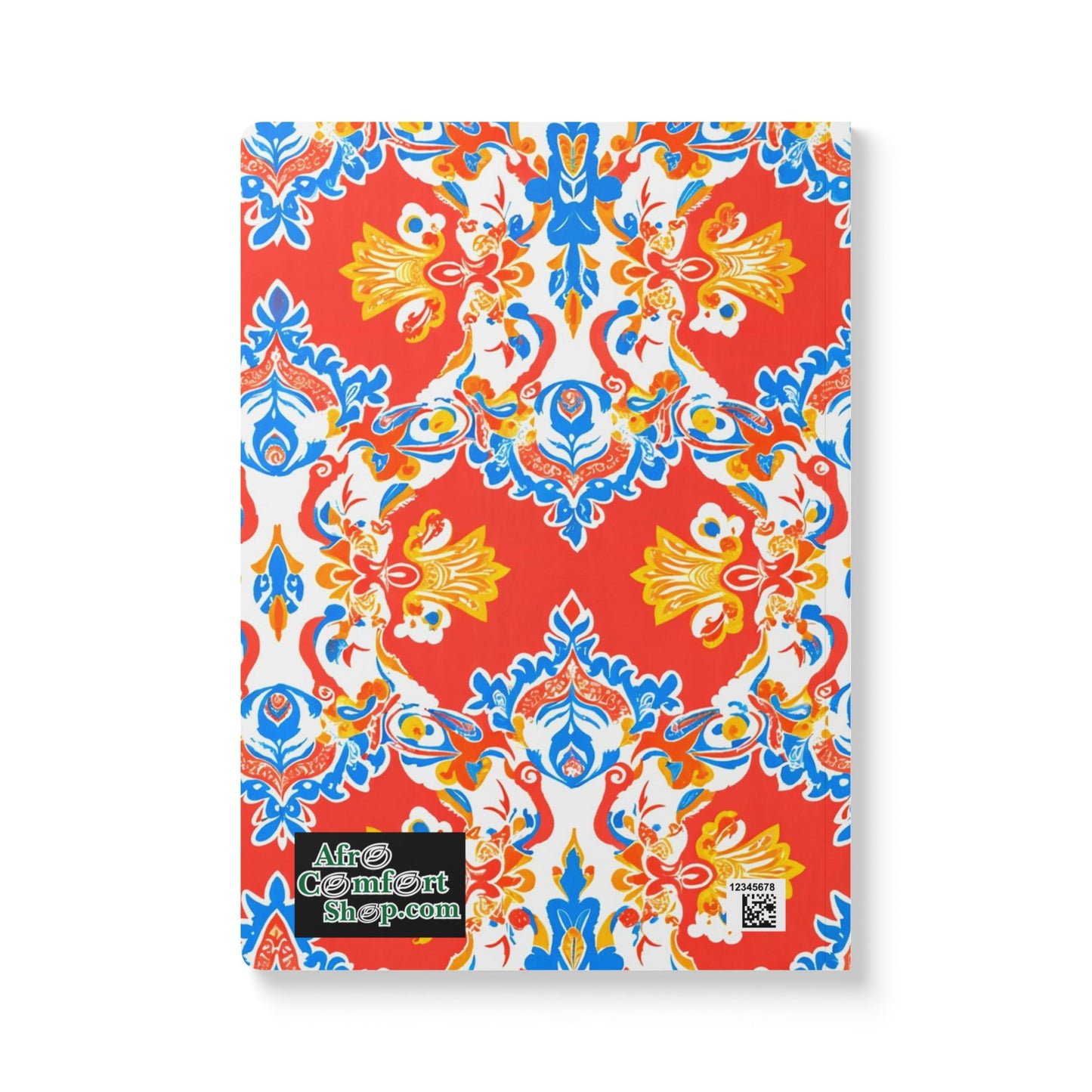 A vibrant African-inspired journal featuring a red, blue, yellow, and white symmetrical floral pattern. The cover includes a green and black AfroComfortShop.com label and a QR code sticker in the lower left corner. Perfect for daily journaling.