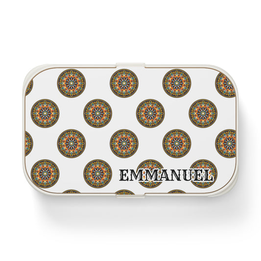 A rectangular BPA-free lunchbox features a repeating pattern of ornate, circular mandala designs in various colors. The name “EMMANUEL” appears in bold black letters near the bottom right corner of the lid.