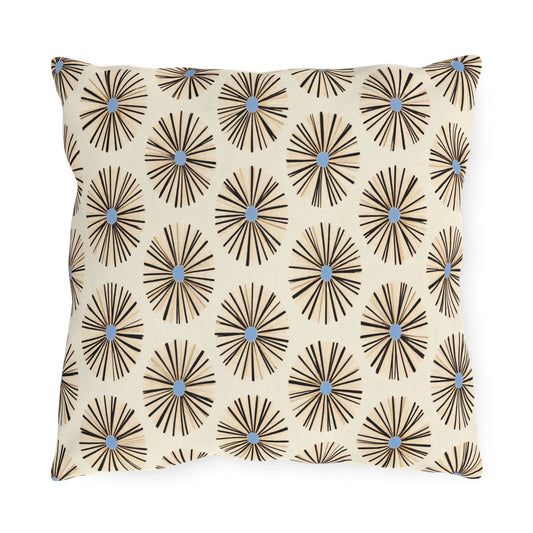 Square pillow with a cream background, featuring an African-inspired pattern of black radiating lines forming circular starburst shapes, each with a small blue dot in the center. The design repeats evenly across the pillow’s surface.