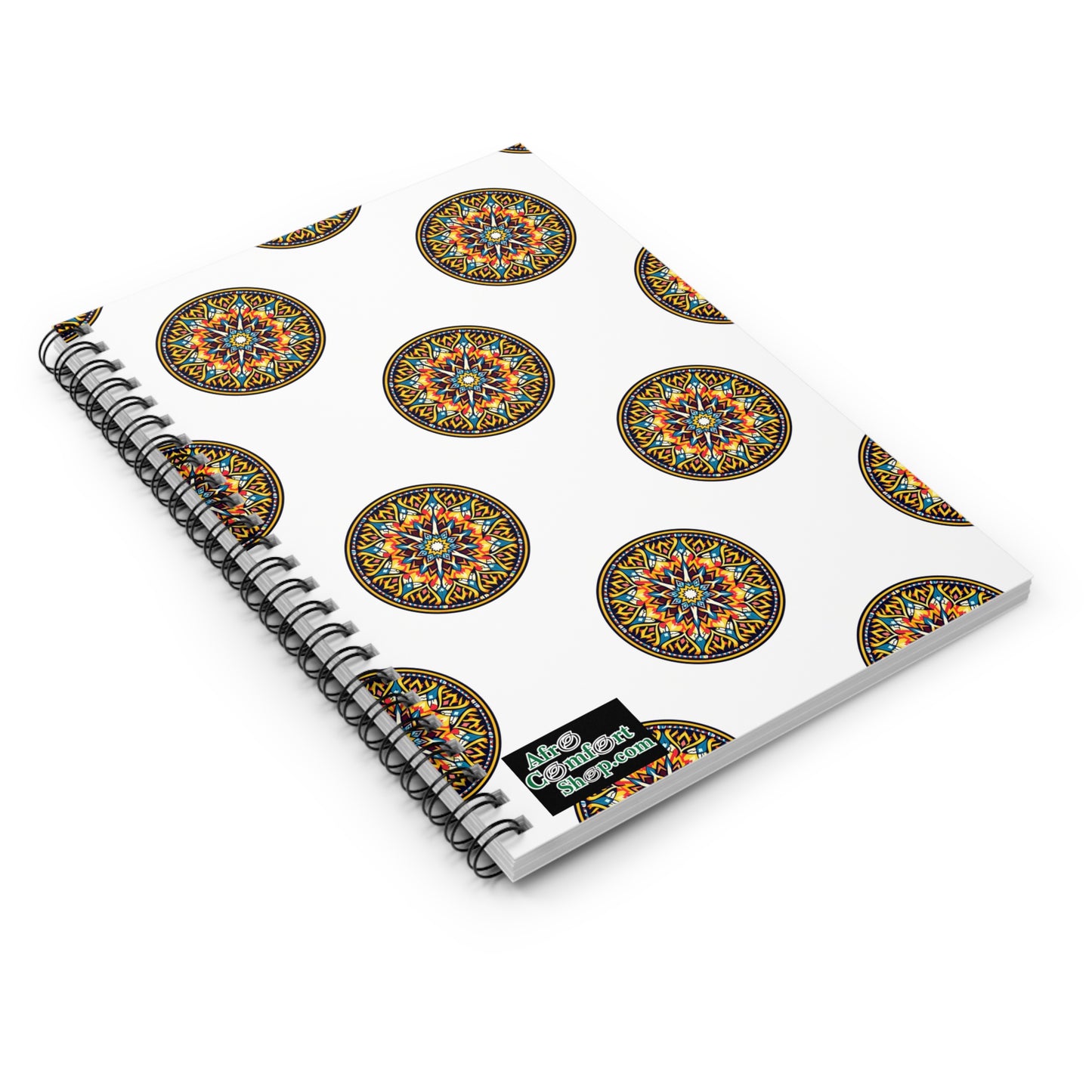 A white spiral notebook with a repeating pattern of colorful, circular Aztec-style designs. Each intricate geometric motif pops in orange, blue, yellow, and green—perfect as a culturally inspired journal for creative ideas and notes.