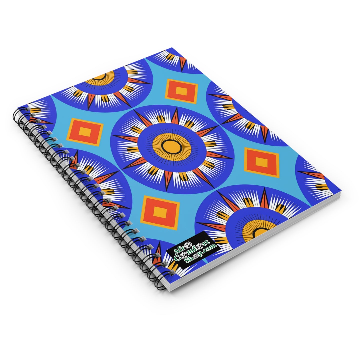 A spiral-bound African-inspired spiral notebook with a bright blue cover featuring bold, geometric patterns of concentric circles and diamond shapes. The lower right corner displays a small “Afro Conscious Creations” logo in white and green.