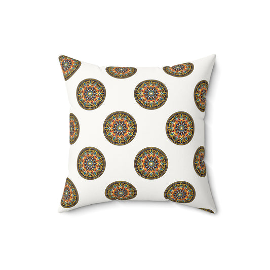 Square faux suede pillow with a repeating pattern of ornate, circular mandala designs in vibrant colors—blue, orange, yellow, and green—evoking an African pattern accent pillow. The crisp white background highlights the vivid patterns.