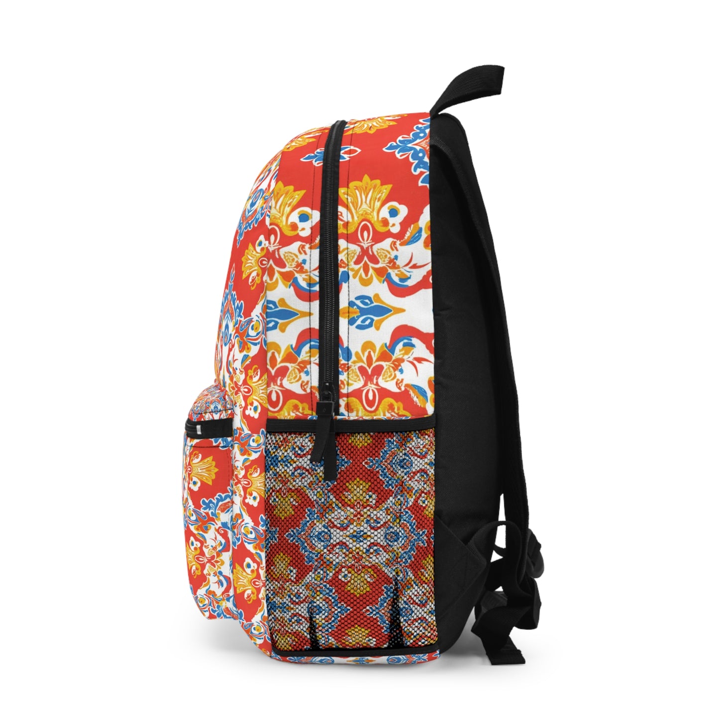 A side view of a vibrant backpack with red, yellow, blue, and white floral and geometric patterns. This African-inspired backpack features a black zipper, black adjustable straps, and a front pocket, all set against a white background.