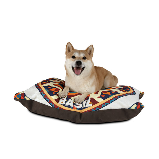 A Shiba Inu with tan fur and white markings lounges on a personalized pet bed with BASIL written on it. The colorful geometric-patterned bed offers luxurious comfort, while the happy dog smiles against a plain white background.