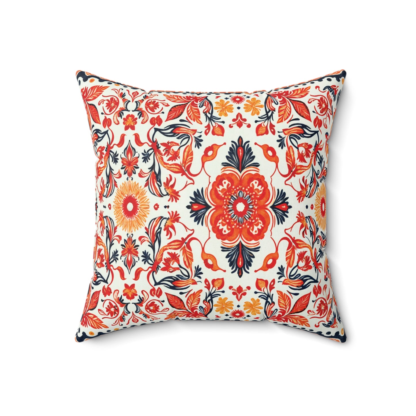 Square accent pillow with a white background featuring an intricate floral pattern in red, orange, yellow, and navy blue. This Faux suede pillow boasts bold central flowers and leafy accents for a vibrant, African inspired decor touch.