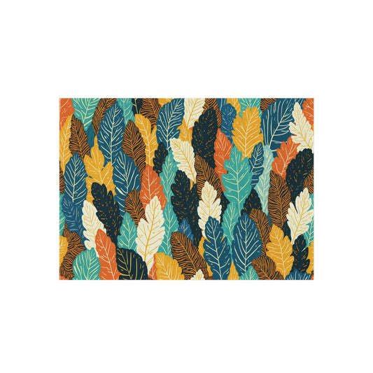 A seamless, African-inspired pattern featuring overlapping leaves in shades of teal, mustard yellow, orange, off-white, and dark blue. Each leaf has fine veins, creating a dense, vibrant tropical foliage effect on a white background.