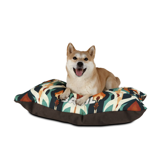 A happy Shiba Inu dog lies on a cozy pet bed with colorful abstract shapes in teal, orange, and brown tones. The dog’s mouth is open, tongue out in a cheerful smile. The durable construction ensures comfort against the plain white background.