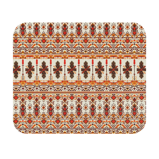 A rectangular mat with rounded corners features a symmetrical, intricate folk pattern in red, orange, gold, and brown. This African-inspired mouse pad displays stylized leaves and geometric shapes on cream, offering a vibrant desk accessory with a non-slip rubber base.