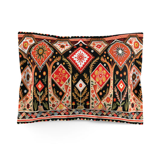 Rectangular pillow with a vibrant, intricate African-inspired pattern in red, orange, gold, and white on a black background. Stylized flowers, diamonds, and geometric motifs create a rich, ornate, tapestry-like appearance.