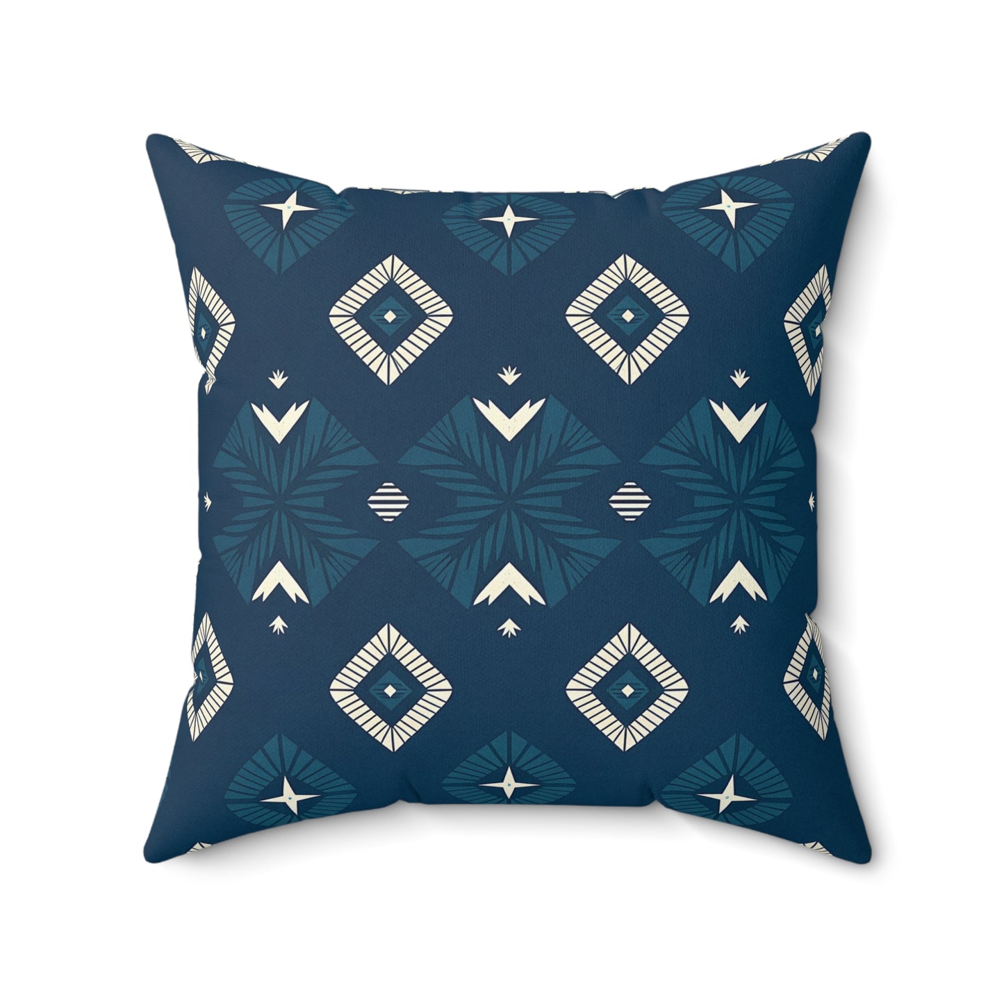 A square decorative pillow with a dark blue background, featuring vibrant patterns of cream and teal diamond shapes, stylized arrows, and starbursts—perfect for adding modern flair to your home decor.