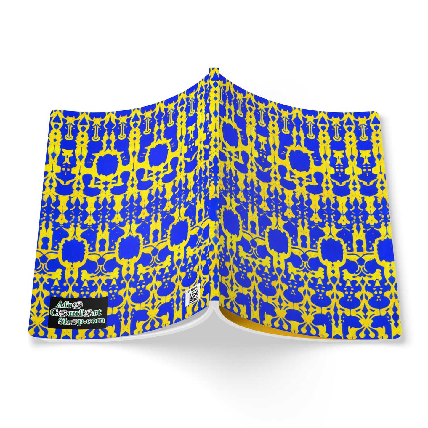 A creative journal with a bright blue and yellow intricate geometric pattern reminiscent of African-inspired designs is open, facing down. A small label in the bottom left corner reads “Art of Consent.” The background is white.