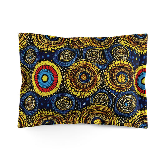 A pillowcase featuring a vibrant, abstract pattern of concentric circles in yellow, blue, red, and black, resembling traditional African designs. These premium pillow shams offer a lively and dynamic appearance to elevate any space.