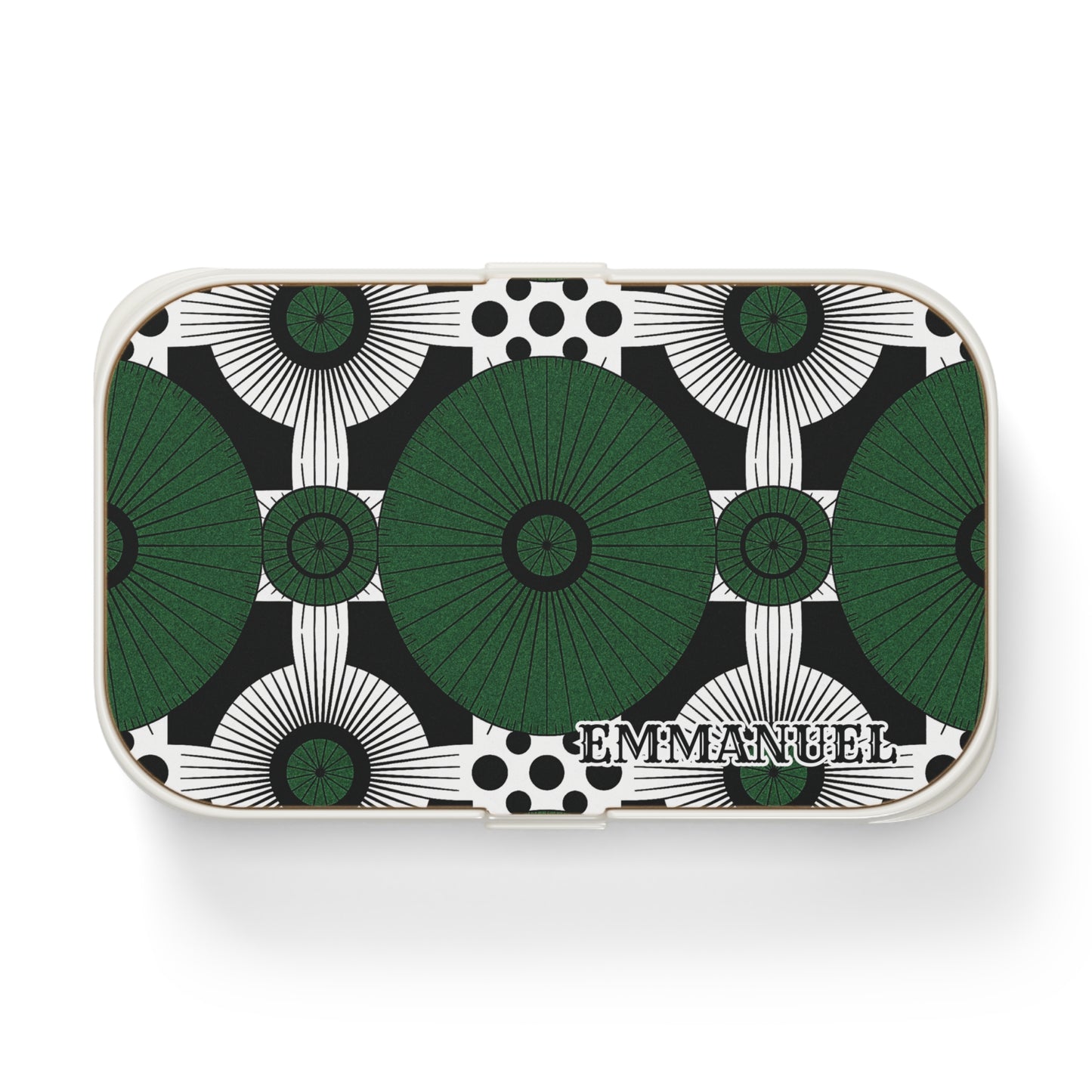Rectangular custom lunch box with a geometric pattern of large green and black circular shapes and black dots on a white background. The bold, symmetrical design is personalized with EMMANUEL in serif letters in the lower right corner.