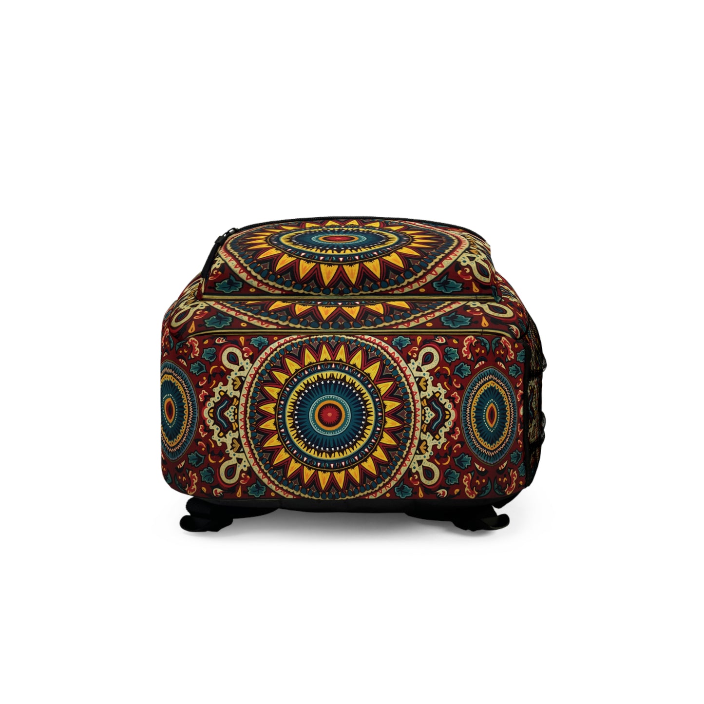 A square ottoman with a vivid, intricate mandala pattern in red, yellow, blue, and green. The design features concentric circles and floral motifs on all sides, adding a boho chic touch reminiscent of a vibrant backpack. The ottoman stands on small black feet.