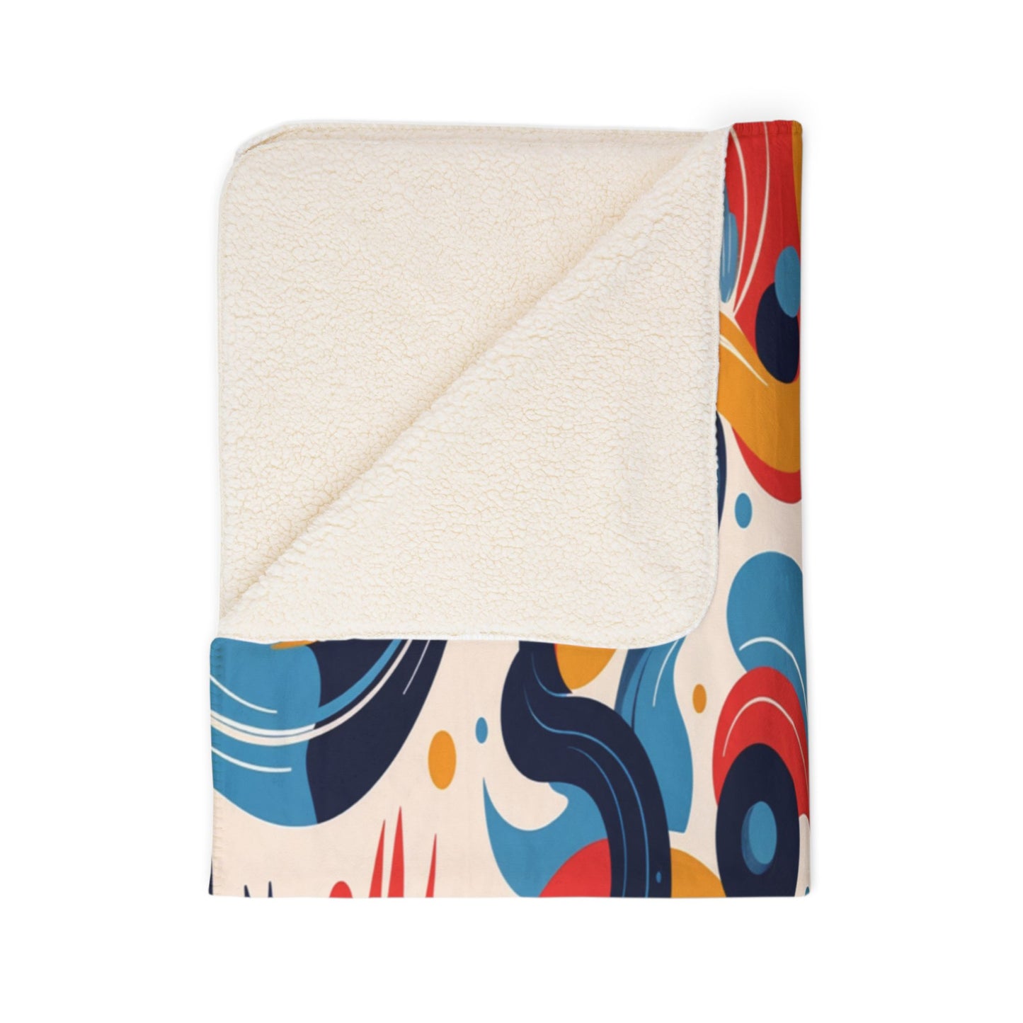 A folded sherpa fleece blanket with a cream sherpa lining and a vibrant, African-inspired abstract pattern in blue, red, orange, black, and yellow. The corner is turned down to reveal the soft underside. The background is white.