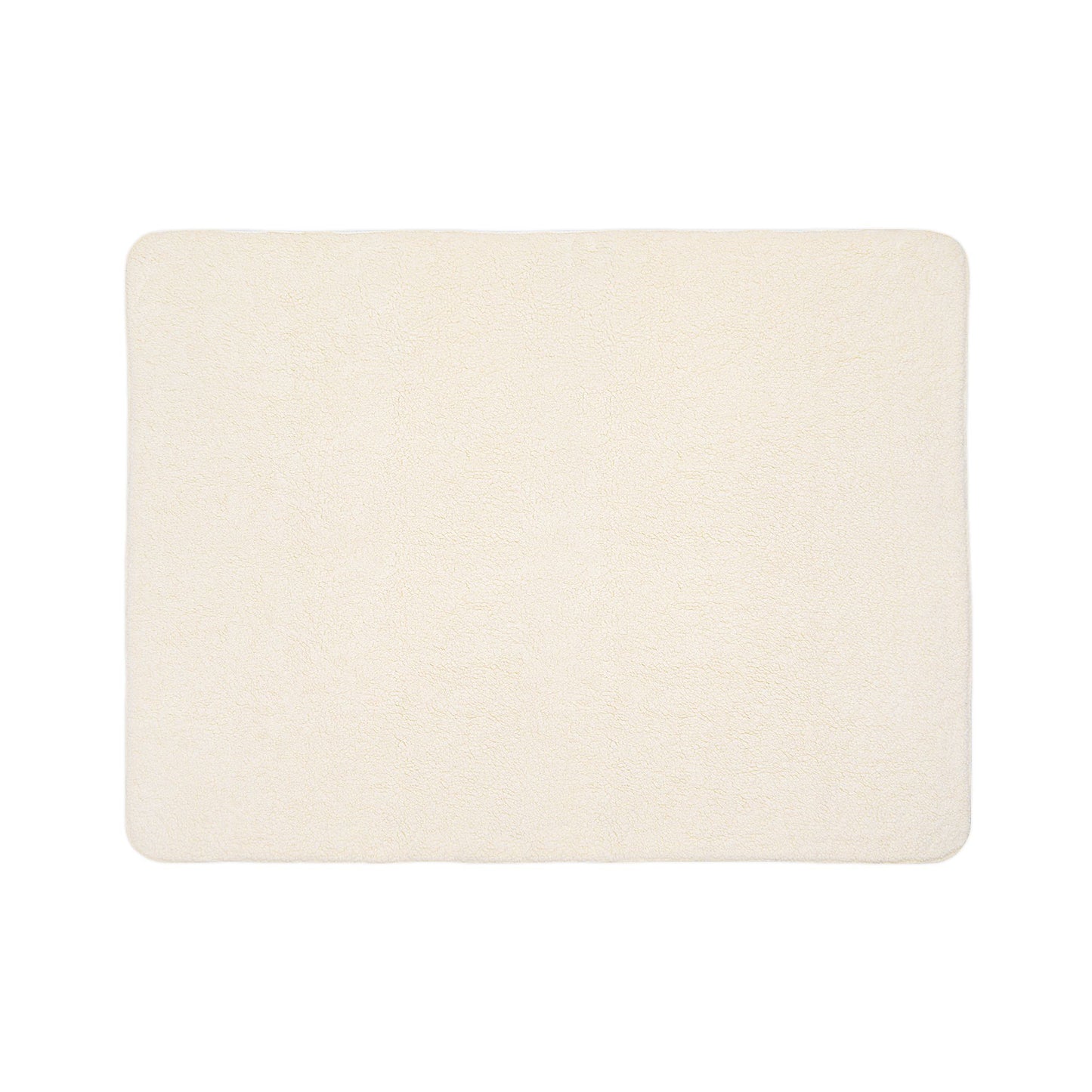 A rectangular, cream-colored bath mat with a soft, plush texture reminiscent of sherpa fleece. The edges are slightly rounded, and the surface appears smooth and uniform. The mat is photographed on a plain white background.